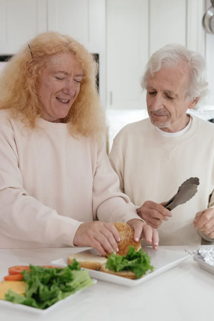 Two people preparing a meal together in a bright home kitchen